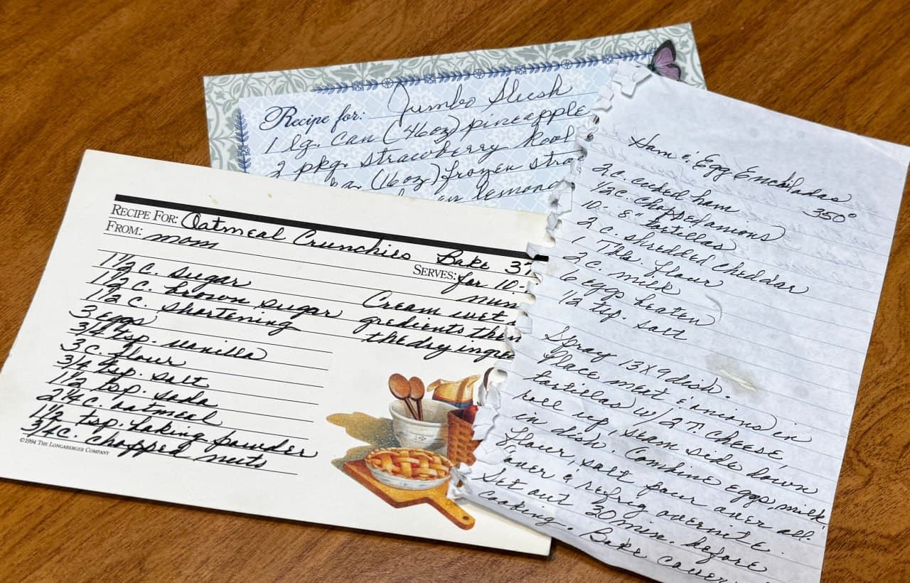 Handwritten family recipe cards on a wooden table